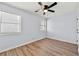 Bright bedroom with hardwood floors, ceiling fan, and large windows at 459 Orchard Dr, Stone Mountain, GA 30083