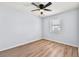Cozy bedroom featuring hardwood floors and a ceiling fan at 459 Orchard Dr, Stone Mountain, GA 30083