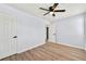 Comfortable bedroom with ceiling fan, hardwood floors, and closet space at 459 Orchard Dr, Stone Mountain, GA 30083