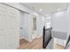 Upstairs hallway leading to bedrooms and bathrooms with hardwood floors and neutral paint at 459 Orchard Dr, Stone Mountain, GA 30083