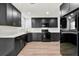 New kitchen features black cabinets, white countertops, stainless steel appliances, and modern fixtures at 459 Orchard Dr, Stone Mountain, GA 30083