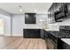 Modern kitchen featuring black cabinetry, stainless steel appliances, and stylish countertops at 459 Orchard Dr, Stone Mountain, GA 30083
