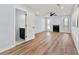 Spacious living room with wood floors, fireplace, ceiling fan, and access to a wet bar at 459 Orchard Dr, Stone Mountain, GA 30083