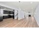 Open concept living space featuring updated kitchen, dining area, living room, and modern finishes at 459 Orchard Dr, Stone Mountain, GA 30083