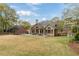 Large backyard with spacious deck for entertaining and a beautiful green lawn at 107 Grand Ave, Suwanee, GA 30024