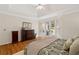 Large main bedroom with tray ceilings and access to backyard and neutral decor at 107 Grand Ave, Suwanee, GA 30024
