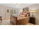 Comfortable bedroom with a plush bed, soft lighting, and scenic window view at 107 Grand Ave, Suwanee, GA 30024