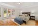Large main bedroom with access to the backyard, tray ceiling and neutral decor at 107 Grand Ave, Suwanee, GA 30024