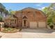 Charming brick home boasting a large garage, inviting curb appeal and lush landscaping at 107 Grand Ave, Suwanee, GA 30024