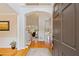 Inviting home foyer with hardwood floors, arched doorways, and elegant trim, leading to the home's spacious interiors at 107 Grand Ave, Suwanee, GA 30024