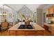 Open concept kitchen with desk area, island cooktop, and great natural light at 107 Grand Ave, Suwanee, GA 30024