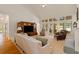 Spacious living room with vaulted ceilings and large windows overlooking the backyard at 107 Grand Ave, Suwanee, GA 30024