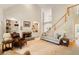 Bright living room with fireplace, built-in bookshelves, and staircase at 107 Grand Ave, Suwanee, GA 30024