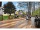 Spacious back deck with outdoor seating and serene view of the backyard at 192 Palisade Point Dr, Ellenwood, GA 30294