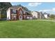 Beautiful two-story home featuring a well-maintained lawn and brick facade at 192 Palisade Point Dr, Ellenwood, GA 30294