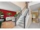 Elegant foyer featuring a staircase, hardwood floors, and bright, welcoming decor at 192 Palisade Point Dr, Ellenwood, GA 30294