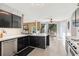 Modern kitchen with sleek countertops, stainless steel appliances, and tile flooring at 192 Palisade Point Dr, Ellenwood, GA 30294