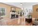 Comfortable living room with fireplace, large windows, and neutral color palette at 192 Palisade Point Dr, Ellenwood, GA 30294