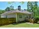 Well-maintained backyard with a fenced perimeter, green lawn, and trees at 210 Mels Way, Stockbridge, GA 30281