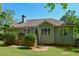 A backyard view showcases a well-maintained lawn and a wooden deck, perfect for outdoor relaxation and entertaining at 210 Mels Way, Stockbridge, GA 30281