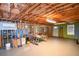 Unfinished basement features an open layout, ideal for storage and future customization with open ceiling at 210 Mels Way, Stockbridge, GA 30281
