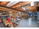 Unfinished basement featuring exposed beams, utilities, and a concrete floor offers potential for customization at 210 Mels Way, Stockbridge, GA 30281