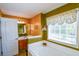 Inviting bathroom with a soaking tub, warm lighting, and a vanity with wood cabinetry at 210 Mels Way, Stockbridge, GA 30281