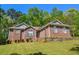 Charming one-story brick home with well-manicured lawn and professional landscaping at 210 Mels Way, Stockbridge, GA 30281