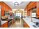 The kitchen showcases modern appliances, sleek countertops, and ample cabinetry at 210 Mels Way, Stockbridge, GA 30281