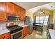 Features stainless steel appliances, wood cabinets, a breakfast nook with a view, and plenty of natural light at 210 Mels Way, Stockbridge, GA 30281