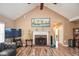 The living room features a decorative fireplace, ceiling fan, hardwood floors and neutral walls at 210 Mels Way, Stockbridge, GA 30281