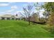 Beautifully maintained backyard with lush green lawn, mature trees, and a serene outdoor setting at 7425 Twin Creek Ct, Cumming, GA 30041
