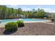 Community pool with a beach entrance, a waterslide, and a poolside cabana at 7425 Twin Creek Ct, Cumming, GA 30041