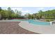 Community pool with a beach entrance, a waterslide, and a six-lane lap-pool at 7425 Twin Creek Ct, Cumming, GA 30041