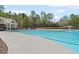 Large community pool with a slide, beach entrance, and a poolside cabana at 7425 Twin Creek Ct, Cumming, GA 30041