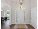 Welcoming foyer with hardwood floors, high ceilings, and an elegant front door at 7425 Twin Creek Ct, Cumming, GA 30041
