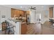 This kitchen features granite countertops, stainless steel appliances, wood-look flooring, a breakfast bar, and lots of cabinets at 7425 Twin Creek Ct, Cumming, GA 30041