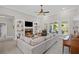 Inviting living room features a fireplace, built-in shelving, neutral walls, and large windows with views of the outdoors at 7425 Twin Creek Ct, Cumming, GA 30041