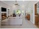 Spacious living room with fireplace, built-in shelves, and large windows at 7425 Twin Creek Ct, Cumming, GA 30041