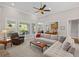 Bright and airy living room with fireplace, large windows, and comfortable seating at 7425 Twin Creek Ct, Cumming, GA 30041