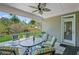 Relax on this covered patio with ceiling fan and comfortable seating to enjoy the outdoors at 7425 Twin Creek Ct, Cumming, GA 30041