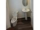 Cozy half bathroom with a pedestal sink and tiled flooring at 87 Sonoma Drive, Dallas, GA 30157