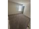 Cozy bedroom features neutral carpeting and a window providing ample natural light at 87 Sonoma Drive, Dallas, GA 30157