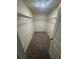 Spacious walk-in closet with shelving and neutral carpeting at 87 Sonoma Drive, Dallas, GA 30157
