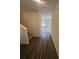 View of the entryway with wood floors leading to a carpeted living area at 87 Sonoma Drive, Dallas, GA 30157
