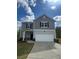 Charming two-story home with a well-maintained lawn and attached two-car garage at 87 Sonoma Drive, Dallas, GA 30157