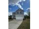 Two-story home with a well-maintained lawn and spacious two-car garage at 87 Sonoma Drive, Dallas, GA 30157