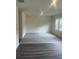 Spacious living room featuring plush carpeting and wood-look flooring at 87 Sonoma Drive, Dallas, GA 30157