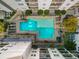 An aerial view of the community pool, lounge area, and surrounding landscaping at 1075 Peachtree Ne Walk # A421, Atlanta, GA 30309