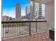 Balcony with wood tile, black railing, and a stunning city view at 1075 Peachtree Ne Walk # A421, Atlanta, GA 30309